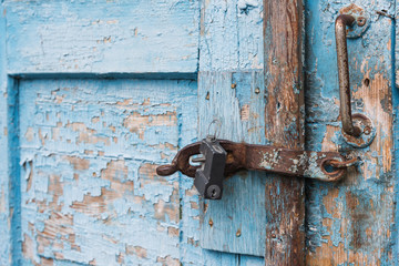 The old door locked with a padlock hanging brackets. Set of backgrounds