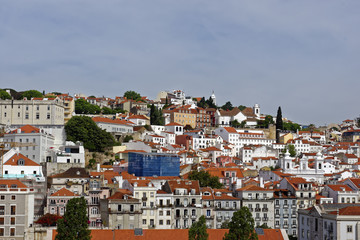 Fototapeta na wymiar View from the River Tagus of the colorful hilly Lisbon, Portugal