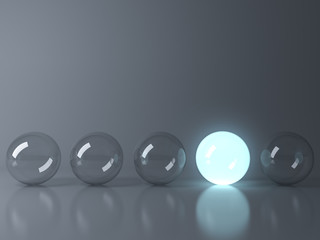 One blue glowing light ball standing out from the unlit glass balls on dark grey background with reflection and shadow , individuality and different creative idea concepts . 3D rendering.