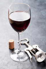 Red wine glass and corkscrew