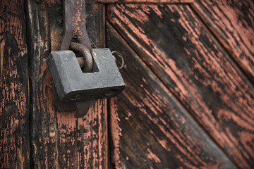 The old door locked with a padlock hanging brackets. Set of backgrounds
