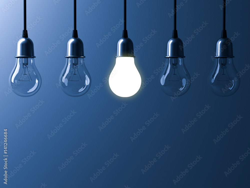 Poster one hanging light bulb glowing different and standing out from unlit incandescent bulbs with reflect
