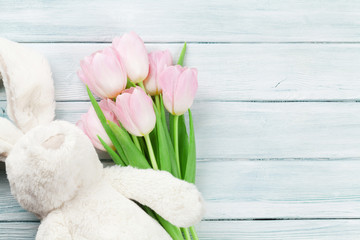 Fototapeta na wymiar Pink tulips and rabbit. Easter card