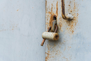The old door locked with a padlock hanging brackets. Set of backgrounds