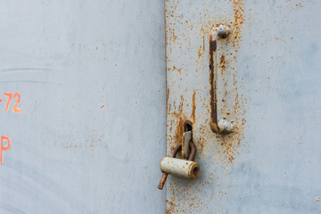 The old door locked with a padlock hanging brackets. Set of backgrounds