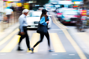 crowd of people crossing a street