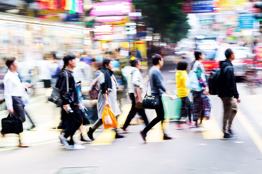 Crowd Of People Crossing A Street In Hongkong