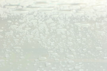 Water drop on white roof car, white background