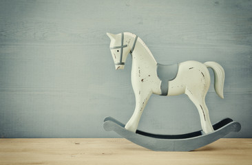 vintage rocking horse on wooden floor