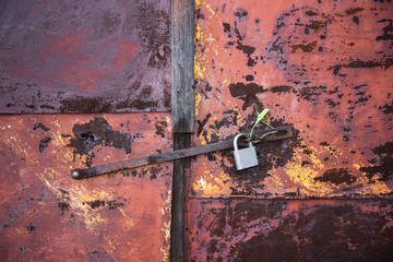 The old door locked with a padlock hanging brackets. Set of backgrounds
