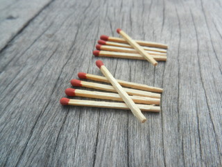 Red wooden match count number on wood background 