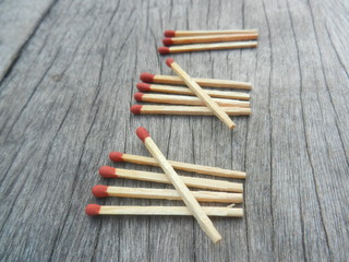 Group of Matchstick on wooden background in concept money , business and education