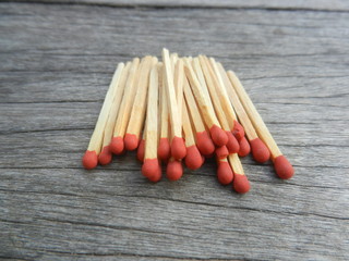 Match on wooden background