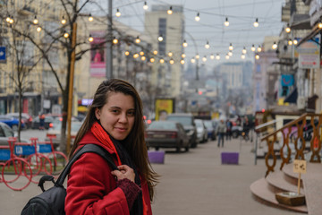 Fashion style portrait of young happy smiling beautiful elegant woman walking at city streets.