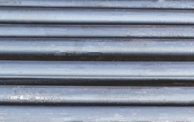 Close up of iron bar that is empty. With thin rusted steel
