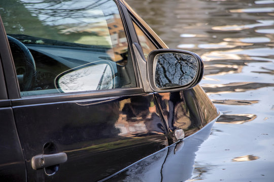 Car submerged in flood water.