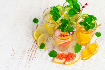 Set of Cucumber grapefruit lemon orange mint  infused water for detox on a white background. Concept of summer drinks