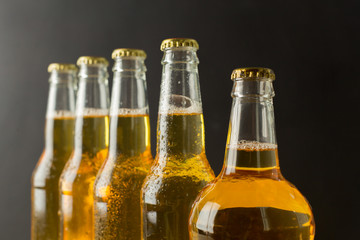 Beer bottles on a wooden table .