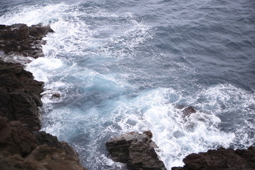 Cliff white waves