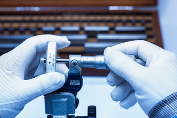 Micrometer Calibration with gauge block in laboratory. - obrazy, fototapety, plakaty