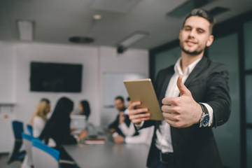 Thumbs up by young guy