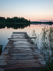 Fototapeta premium sunset over calm lake beach