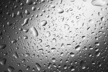 Water drops on dark wall and light, water drop for background and design.