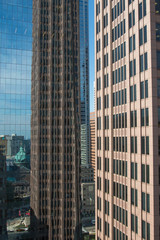 Fototapeta na wymiar Street view with skyscrapers reflected in glass in the City Center of Philadelphia, Pennsylvania, USA.