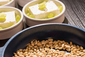 Pan with rosted pine nuts for a dessert