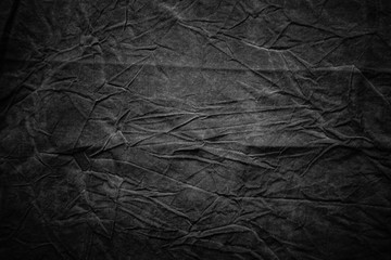 Naklejka premium Texture of dark grey crumpled fabric