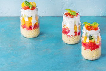 Cous cous with vegetables in mason jar