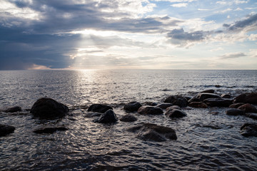 sunset over calm lake beach