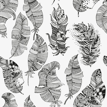 ector seamless pattern of artistically feathers