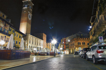 Fototapeta na wymiar Night view of Lamberti clock tower and Erbe square, Verona, Italy.