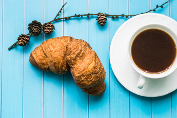Still life with cup of tea and sweets on the wooden background