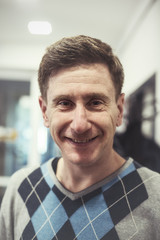 Obraz premium Portrait of a happy, confident man after a haircut - a new image