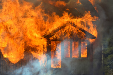 Close up of burning house.