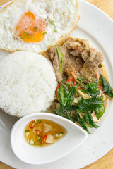 Grilled pork basil with Fried egg , stir basil with crispy pork , Kind of favarite Traditional Thai foods