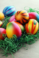 Fototapeta na wymiar Row of Easter eggs on stone table