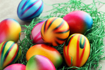 Fototapeta na wymiar Row of Easter eggs on stone table