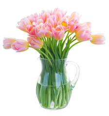 Bouquet of fresh pink and yellow tulips in glass vase isolated on white background