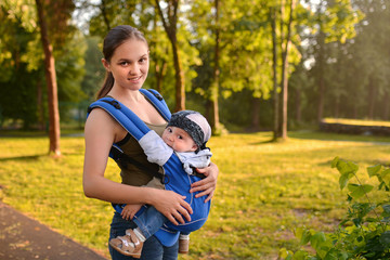 mother and baby walking in park