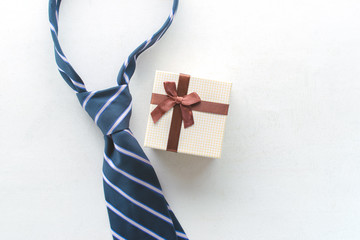 necktie with gift view from above Happy Father's Day inscription background concept.