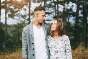 Fototapeta premium Beautiful youth couple flirting and joking in outdoor.