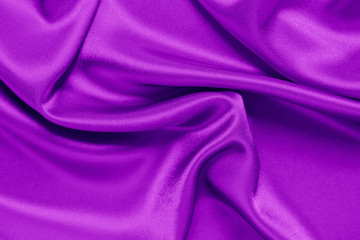 Closeup of rippled purple satin fabric