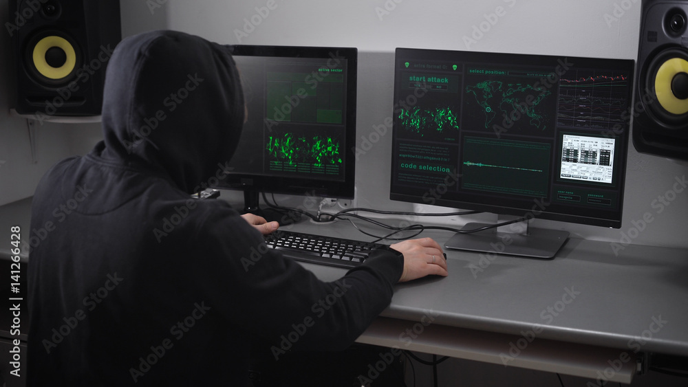 Poster back view of a hooded angry hacker in black making cyber attack on bank network and failuring the pr