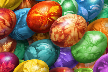 Fototapeta na wymiar Bunch of Colorful Easter Eggs Decorated with Leaves Imprints