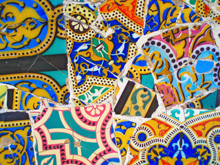 decoration in Park Guell, tile background broken glass mosaic,  Barcelona, Spain. Designed by Gaudi - obrazy, fototapety, plakaty