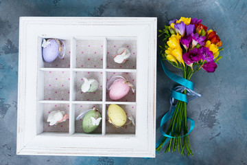 Easter tic tac toe game with eggs and rabbits in box - pastel colors and rustic style