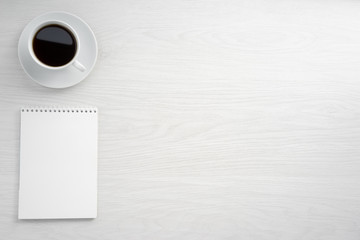 Coffee cup and notepad